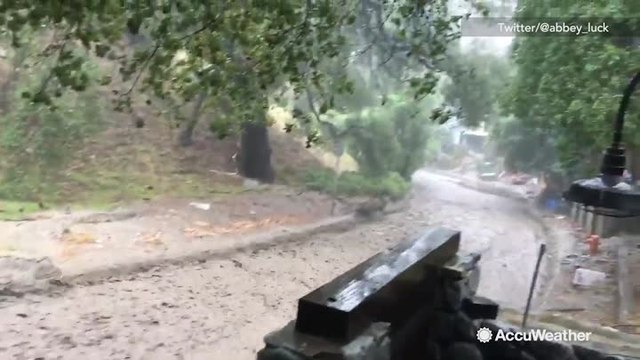 Major flooding down road after heavy rain