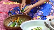 Cambodian rural woman cooking delicious pig head stew today