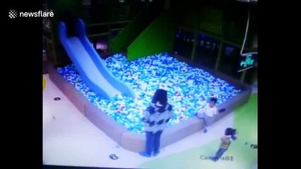 Angry woman throws little girl into ball pit after girl got into fight with her son