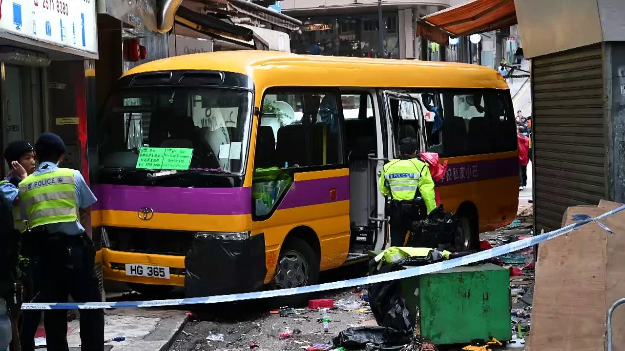 Four killed as Hong Kong schoolbus mounts pavement