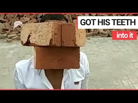 Moment man shows off his bizarre talent for lifting bricks with his TEETH | SWNS TV