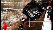 Firefighters rescue driver trapped in semi-trailer hanging off motorway