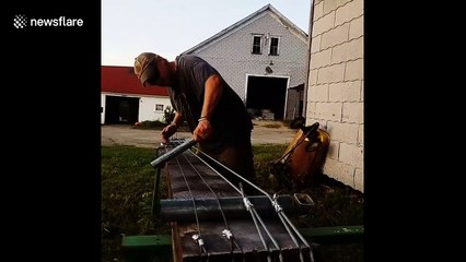 Maine farmer makes enormous bass out of wooden beam