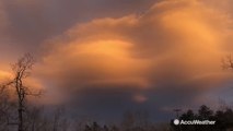 Gorgeous sunset radiates with lenticular clouds