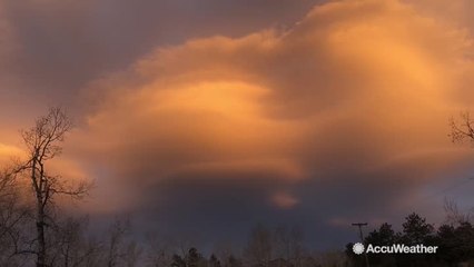 Gorgeous sunset radiates with lenticular clouds