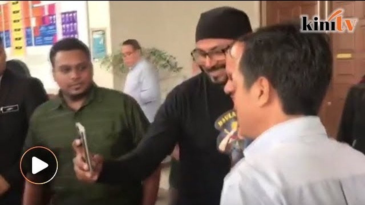 After being charged, Arul Kanda poses for selfie