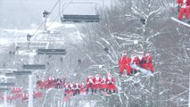 Esqueça as renas! Centenas de Papais Noéis esquiam para caridade