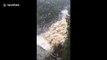 Waterfall turned into cascading rush of water as torrential rain lashes Australian state of Victoria
