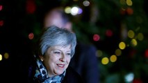 May heads for Brussels after surviving rebels' challenge