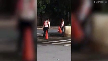 Security Guards Play Cone Flipping Game