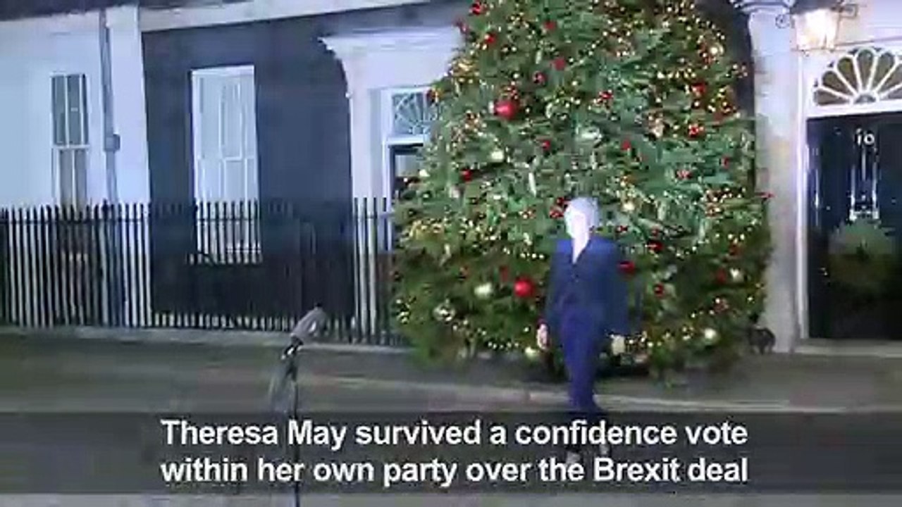 May vows 'assurances' over deal after winning confidence vote