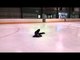 Female Figure Skater Does Skating Trick Lying Down