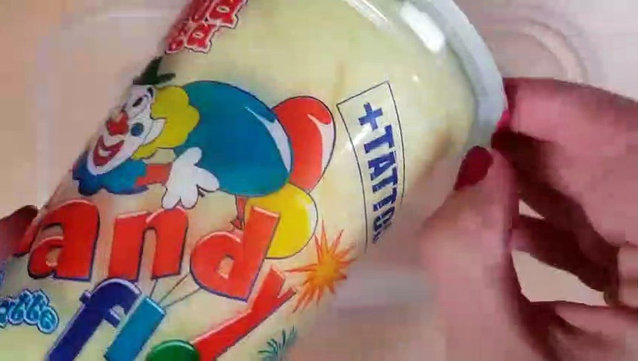 Mixing cotton candy into clear slime