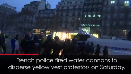 Dramatic moment French police blast water cannons