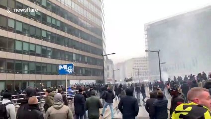 Belgian police fire water cannon at anti-migrant protesters