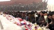 North Koreans head out in snow to mark Kim Jong Il's death
