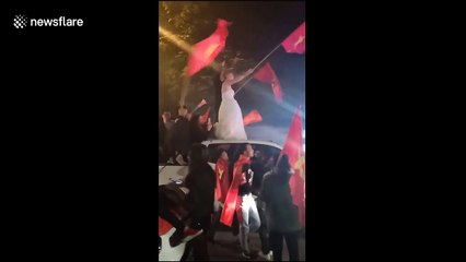 Football superfan wears wedding dress to celebrate Vietnam team win