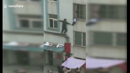 Kind-hearted neighbours save toddler hanging from second-floor window