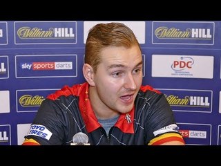 Dimitri Van den Bergh admits he isn't happy after reaching second round of World Darts Championship.