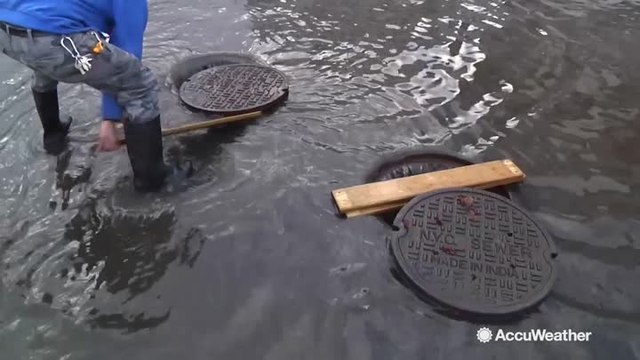 Water sits in streets for days following flooding downpours