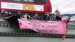 Protesters drop banner from Westminster Bridge in support of Stansted 15