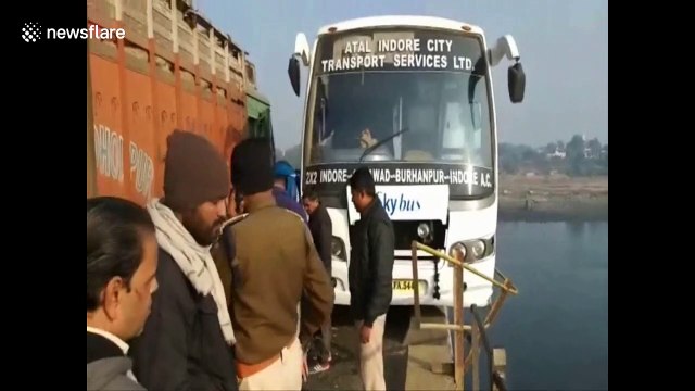 40 passengers get evacuated from bus teetering on the edge of a bridge