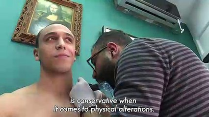 Long despised, tattoos emerge from shadows in Tunisia