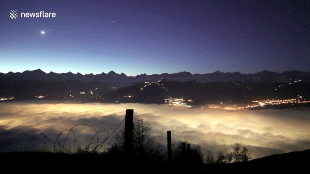 Stunning timelapse shows rolling fog at night and dawn in Swiss valley