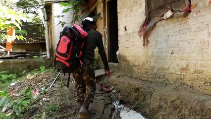 Caught in the act! Snake catcher retrieves reptile trying to swallow a frog