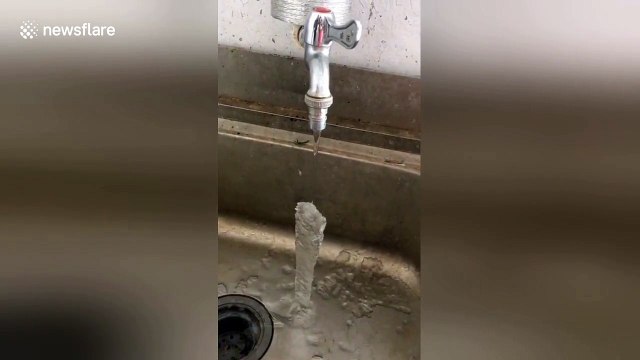 Water running out of tap freezes solid in midair in northern China