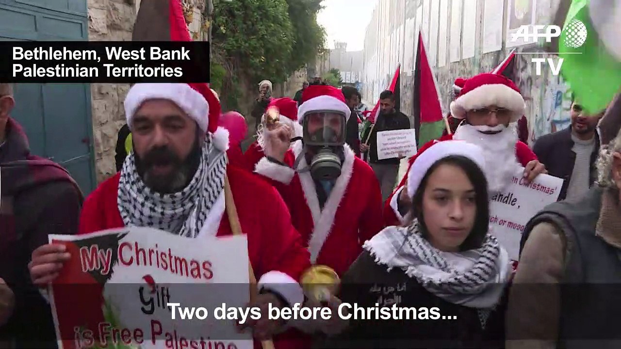 Palestinians dressed as Santa Claus protest in Bethlehem