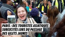 Paris : des touristes asiatiques surexcités lors du passage des Gilets jaunes