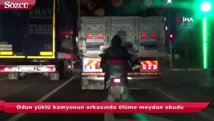 Download Video: Odun yüklü kamyonun arkasında ölüme meydan okudu