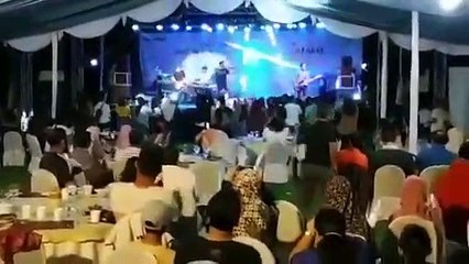 Wave crashes into stage at Indonesian pop band concert