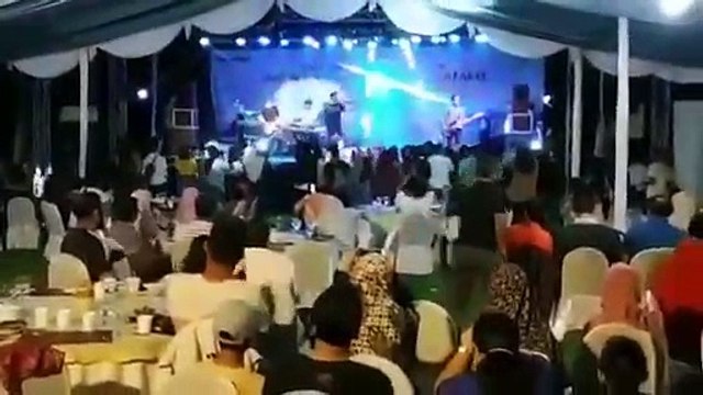 Wave crashes into stage at Indonesian pop band concert