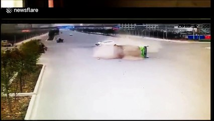 Car hits bus, flipping it over and trapping passengers inside