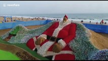 Indian artist creates 'world's biggest Santa' - with 10,000 plastic bottles