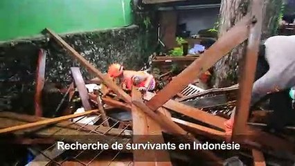 Indonésie: les secouristes fouillent les décombres