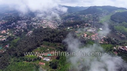 Coonoor town with tea gardens, with clouds moving in over Nilgiri hills