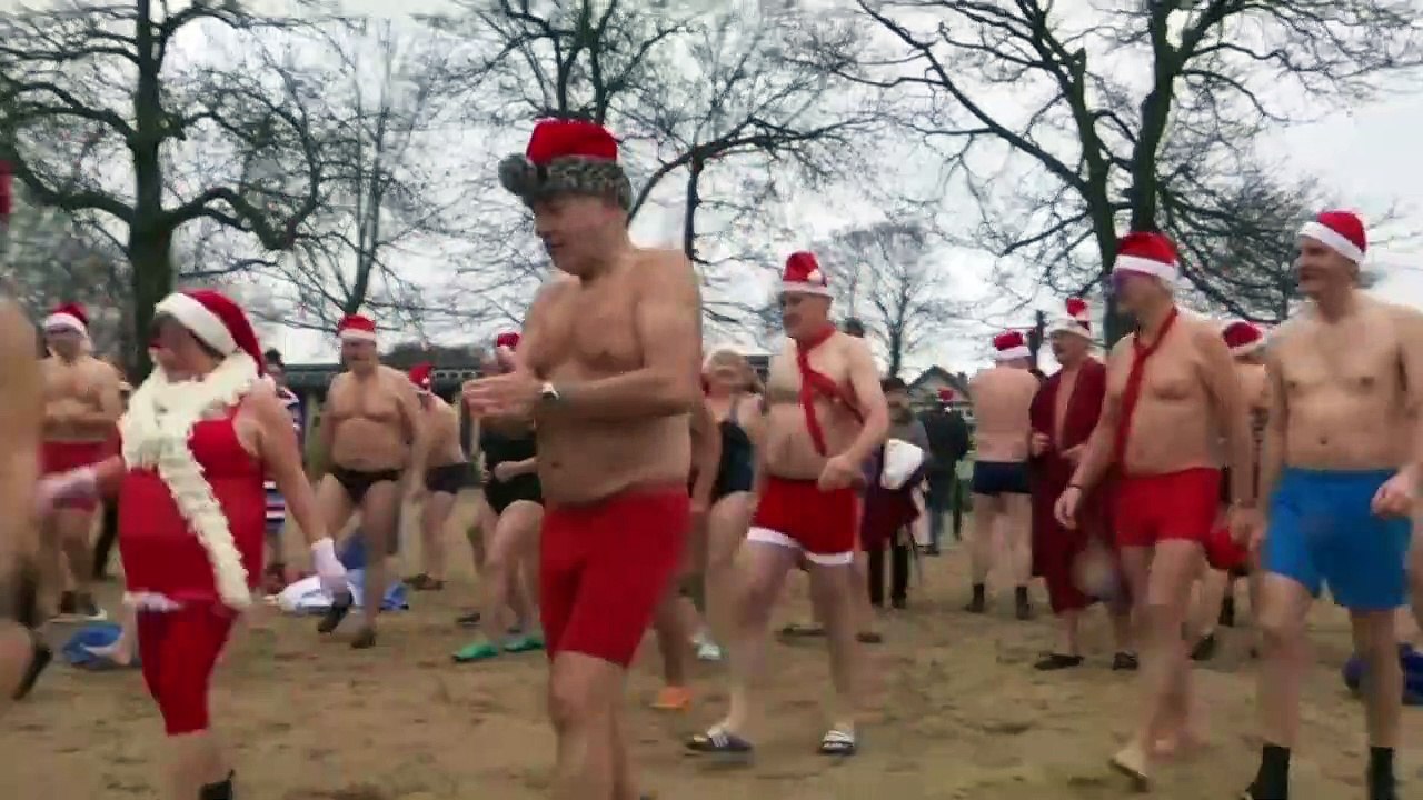 Swimming Santas brave freezing temperatures