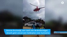 Surinaamse politicus strooit met geld uit helikopter