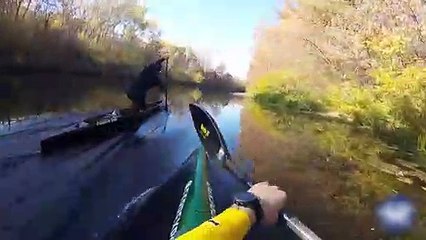 Athlete Sprints Canoe Across Calm Water- funny video
