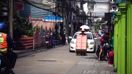 Old Woman Holds Up Traffic With Cargo Of Beer
