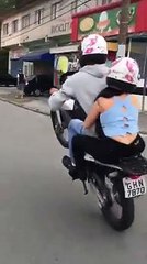 Amazing video of motorcycle one wheeling with companion