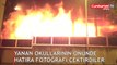 Öğrenciler yanan okullarının önünde hatıra fotoğrafı çektirdi