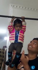 Baby girl doing pull ups with Daddy!