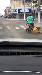 2 guys a little drunk and trying to get on the motorbike........