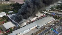 Dramatic drone footage shows massive plumes of black smoke from Thailand warehouse fire