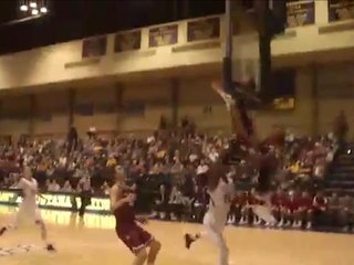 Ouch! College basketball player headbutts backboard while attempting block
