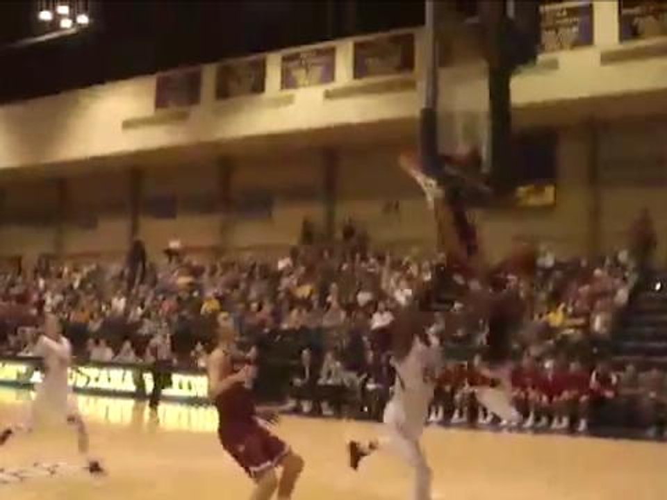 Ouch! College basketball player headbutts backboard while attempting block